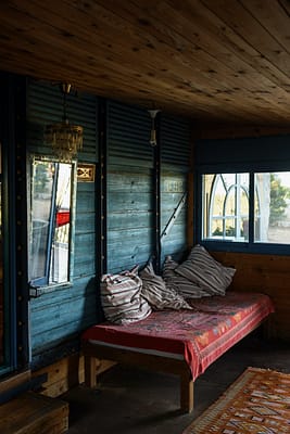 daybed on terrace of old shabby house